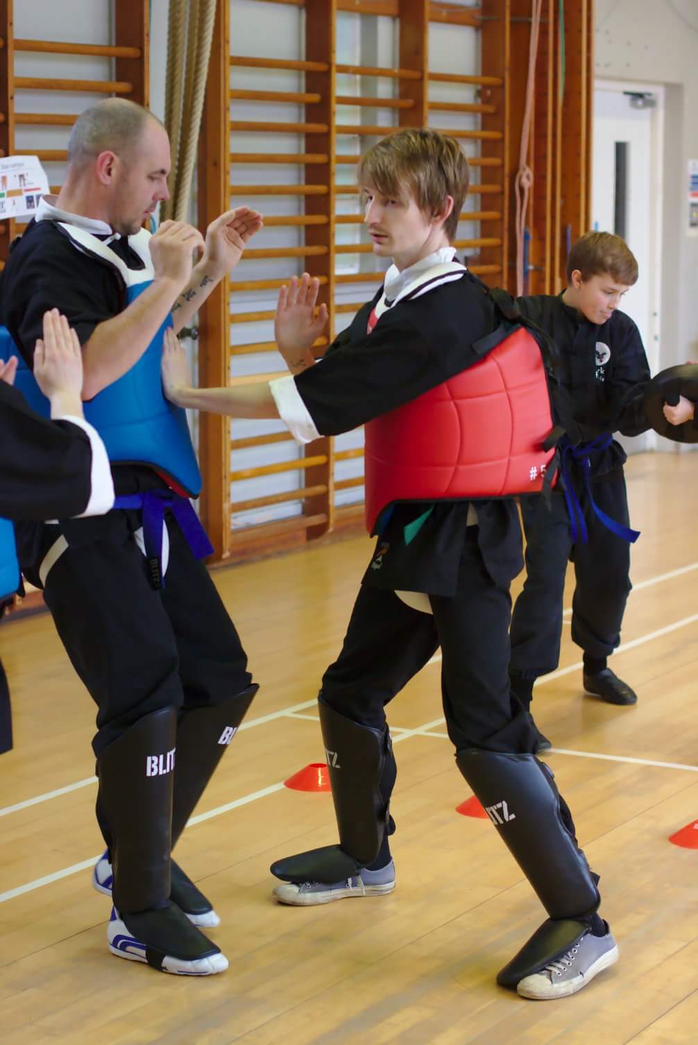 2 male students sparring during Kung Fu grading
