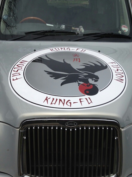 fusion kung fu logo on Norwich taxi