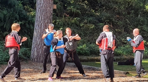 Adults Kung Fu training outside in Norwich